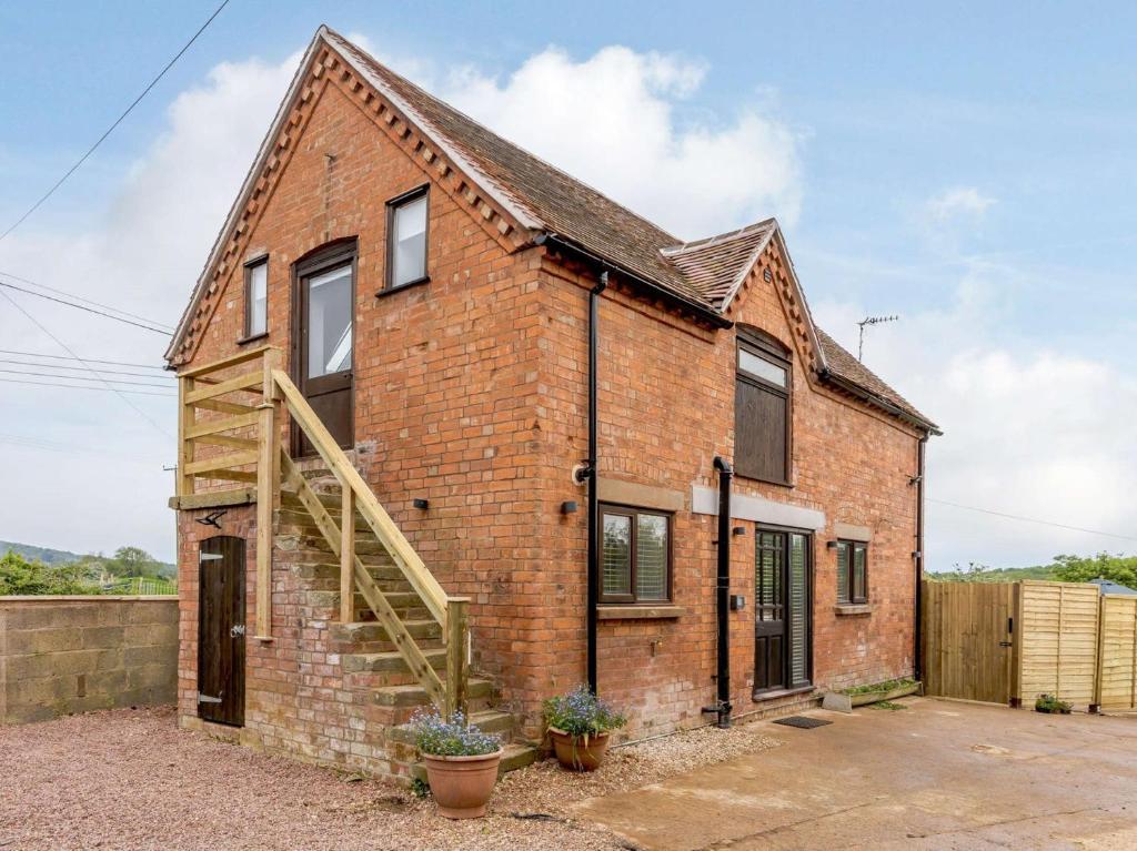 an image of a brick house with a staircase at 2 bed in Eckington 83007 in Eckington