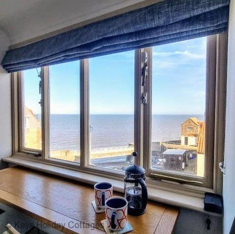 a window with a view of the ocean at Gull View in Sheringham
