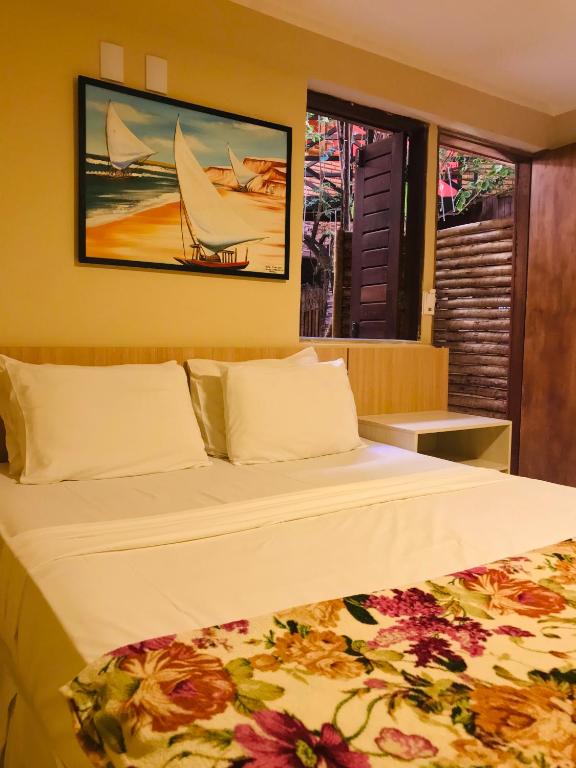 Postel nebo postele na pokoji v ubytování Hotel Pousada Latitude