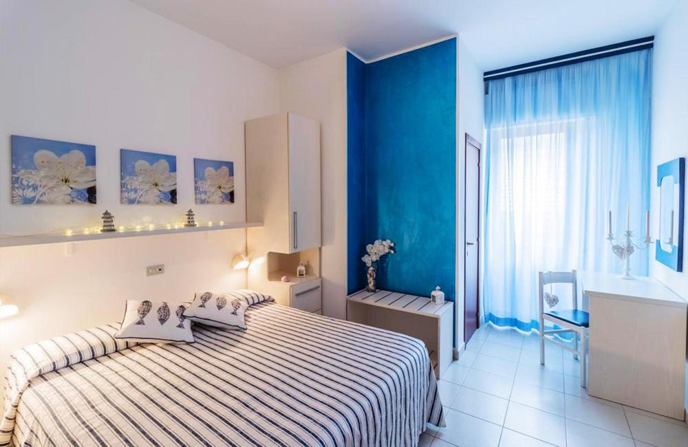 Postel nebo postele na pokoji v ubytování Hotel Corallo