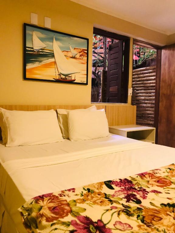 Postel nebo postele na pokoji v ubytování Hotel Pousada Latitude