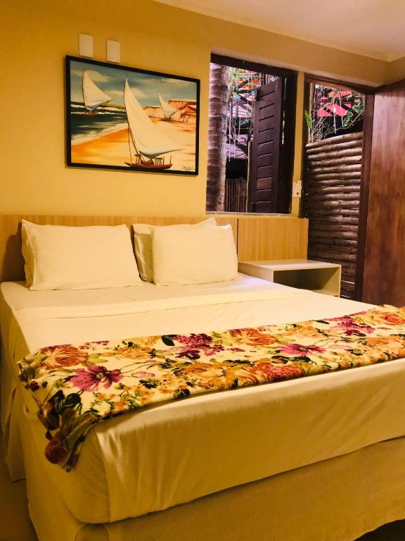 Postel nebo postele na pokoji v ubytování Hotel Pousada Latitude