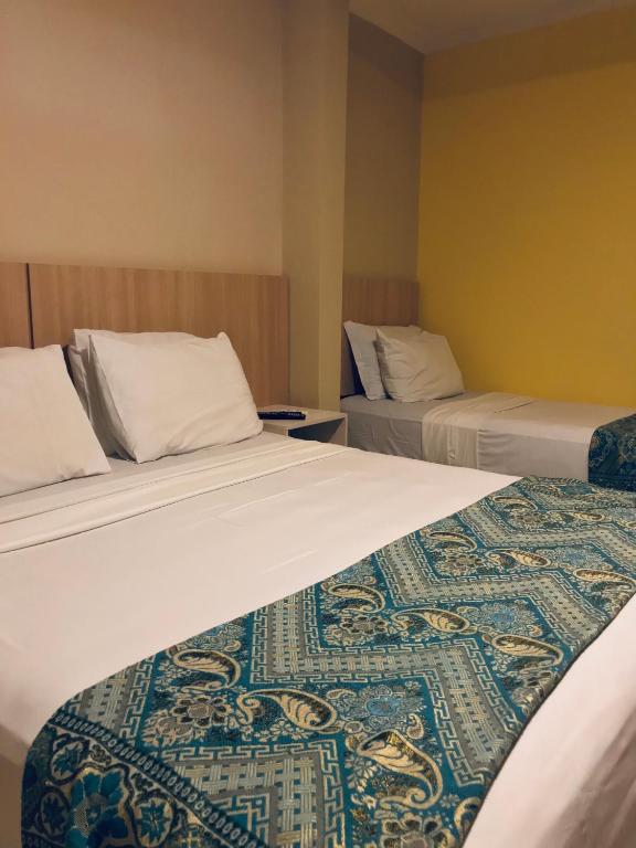 Postel nebo postele na pokoji v ubytování Hotel Pousada Latitude