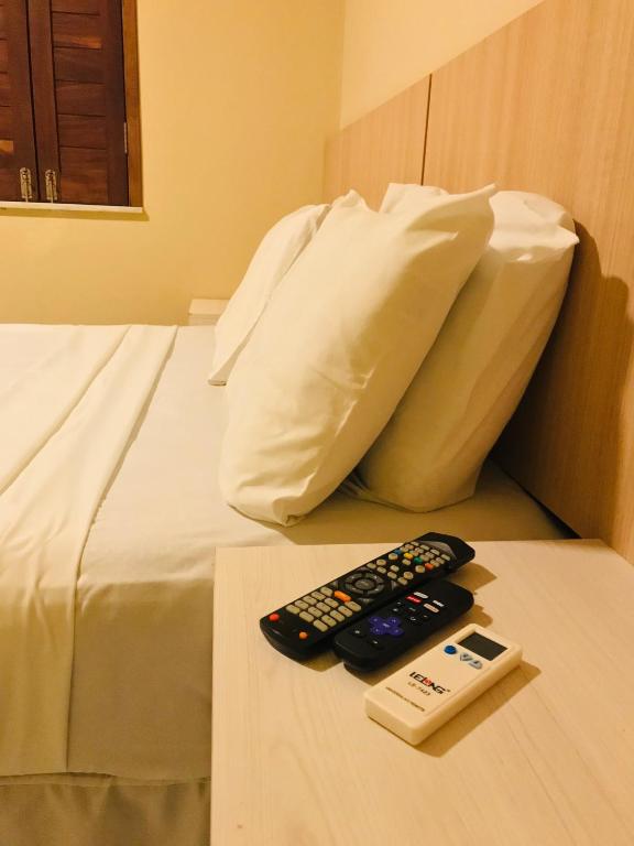 Postel nebo postele na pokoji v ubytování Hotel Pousada Latitude