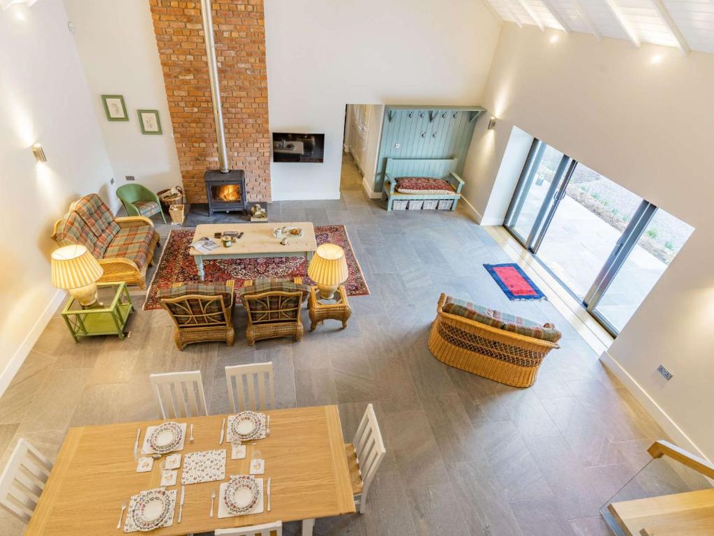 an overhead view of a living room with tables and chairs at 2 bed property in Cowbridge 87576 