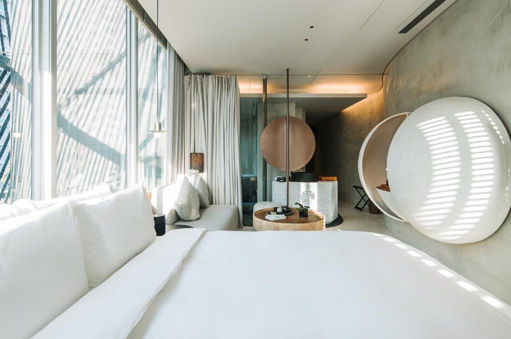 Postel nebo postele na pokoji v ubytování 了了礁溪 Vivir Jiaoxi Hotel