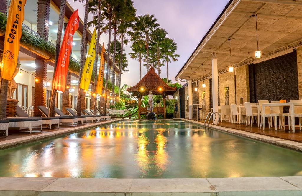 a swimming pool in the middle of a building at North Wing Canggu Resort in Dalung