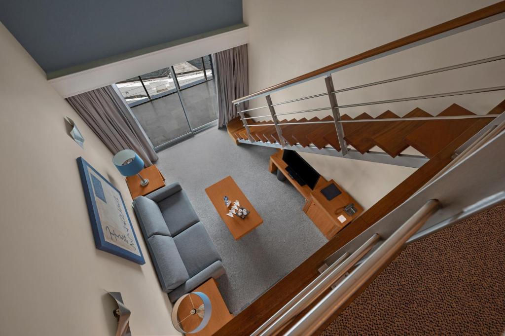 an overhead view of a living room with a staircase at Hotel Do Caracol in Angra do Heroísmo