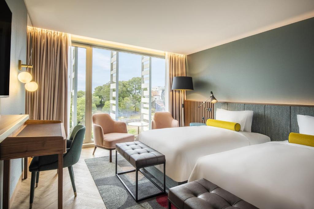 Postel nebo postele na pokoji v ubytování Renaissance Porto Lapa Hotel