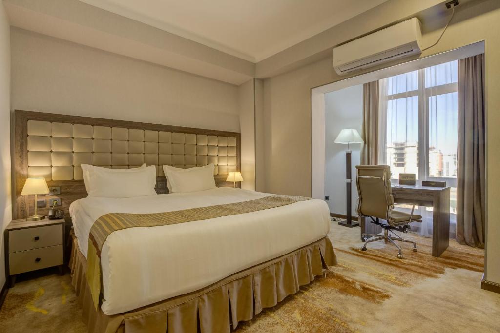 Postel nebo postele na pokoji v ubytování Hotel Lulu