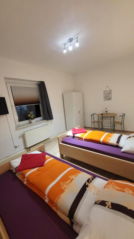 Postel nebo postele na pokoji v ubytování Gasthaus Pavillon