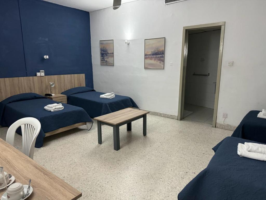 Postel nebo postele na pokoji v ubytování Roma Hotel