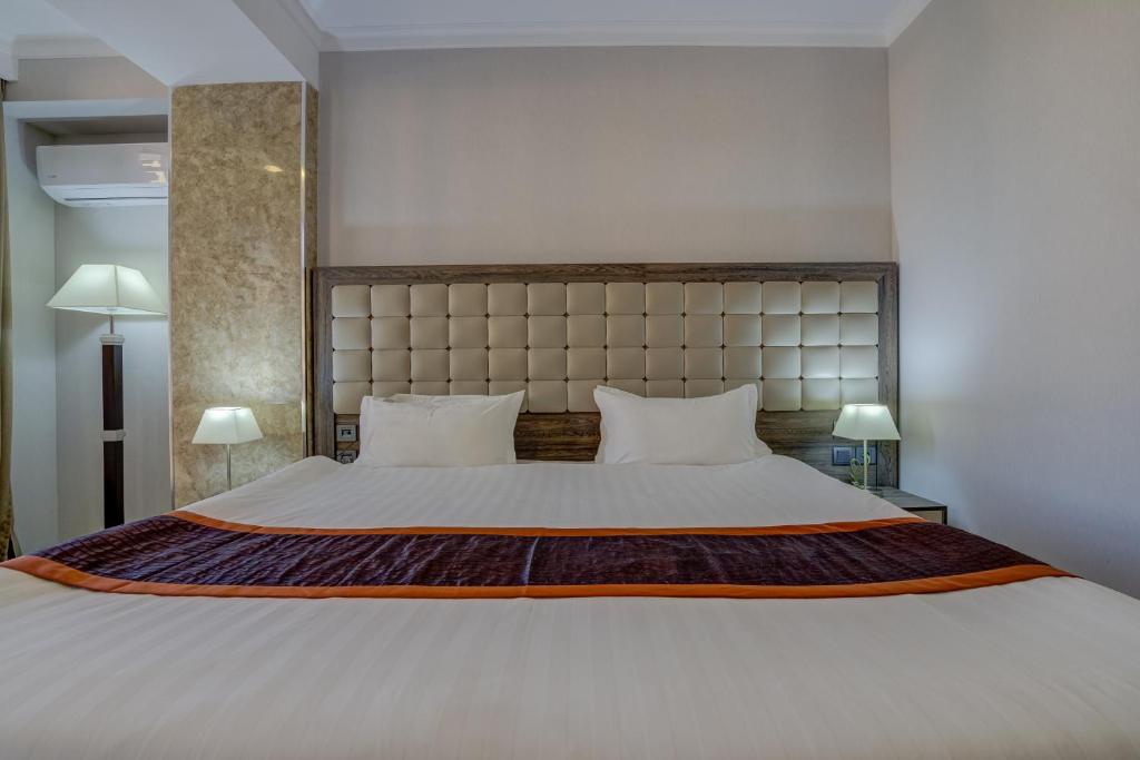 Postel nebo postele na pokoji v ubytování Hotel Lulu