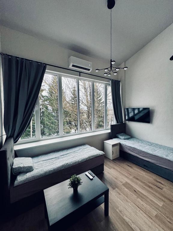Postel nebo postele na pokoji v ubytování AJ Chocolate Vilnius