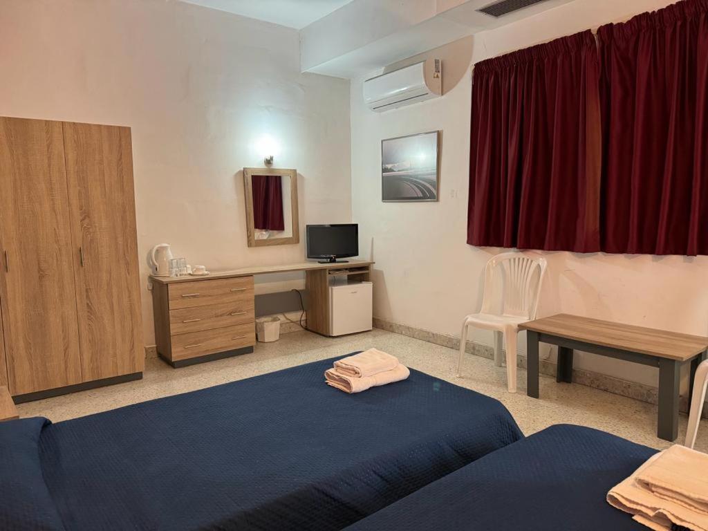 Postel nebo postele na pokoji v ubytování Roma Hotel
