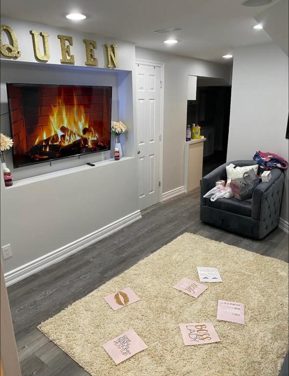 a living room with a fireplace and a couch at Cozy Basement Apartment in Brampton