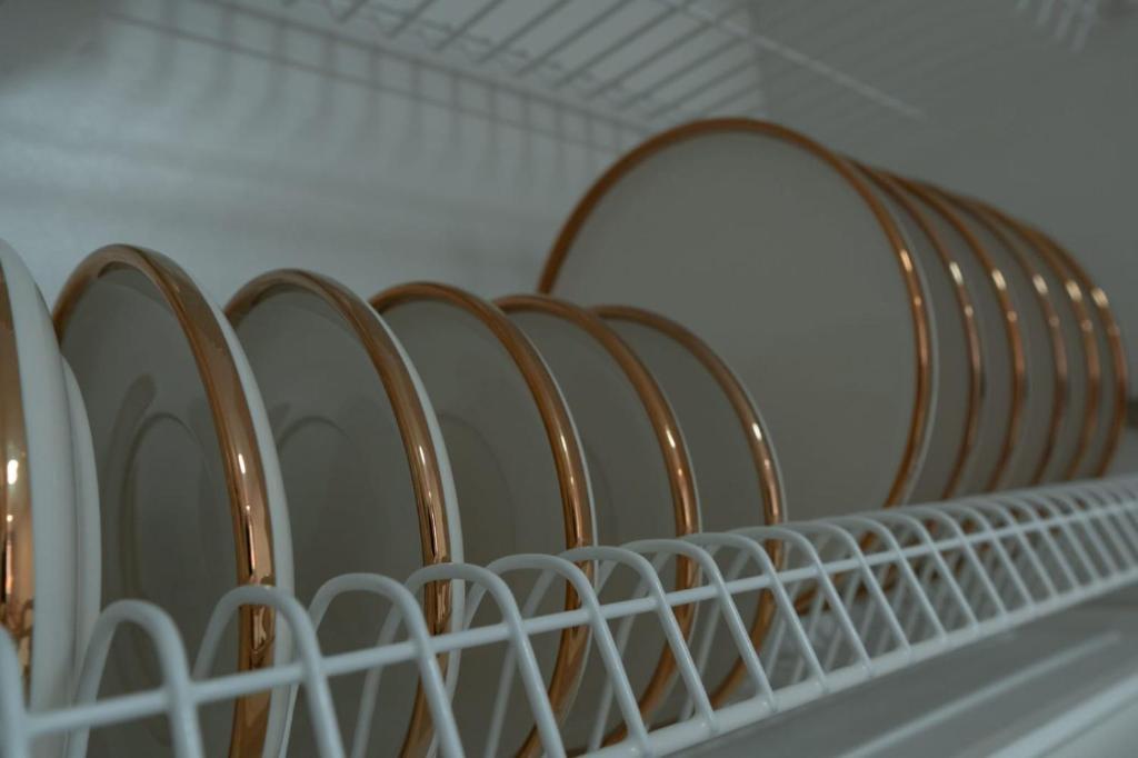 a row of wooden seats in a closet at Евродвушка в ЖК Тениз in Kostanay