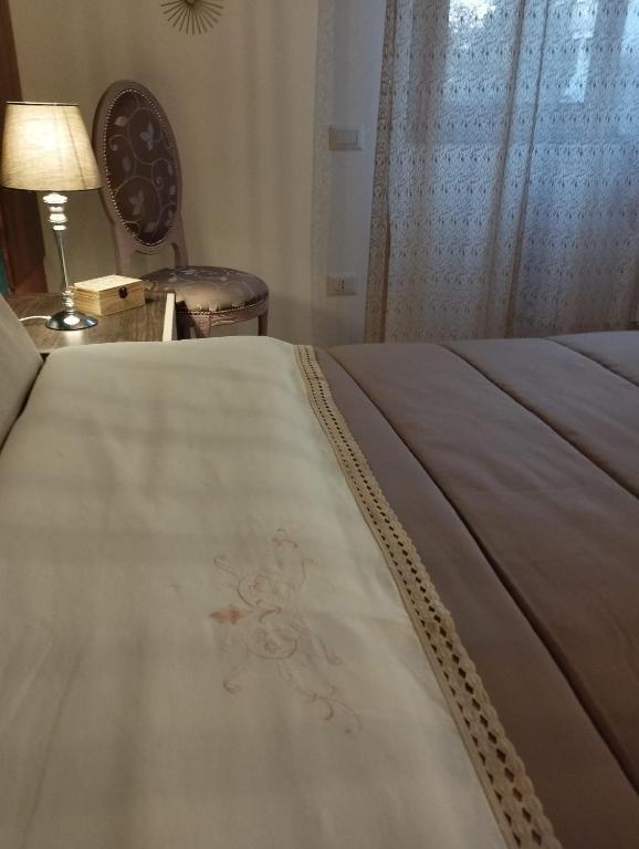 Postel nebo postele na pokoji v ubytování La Dama dei Fiori