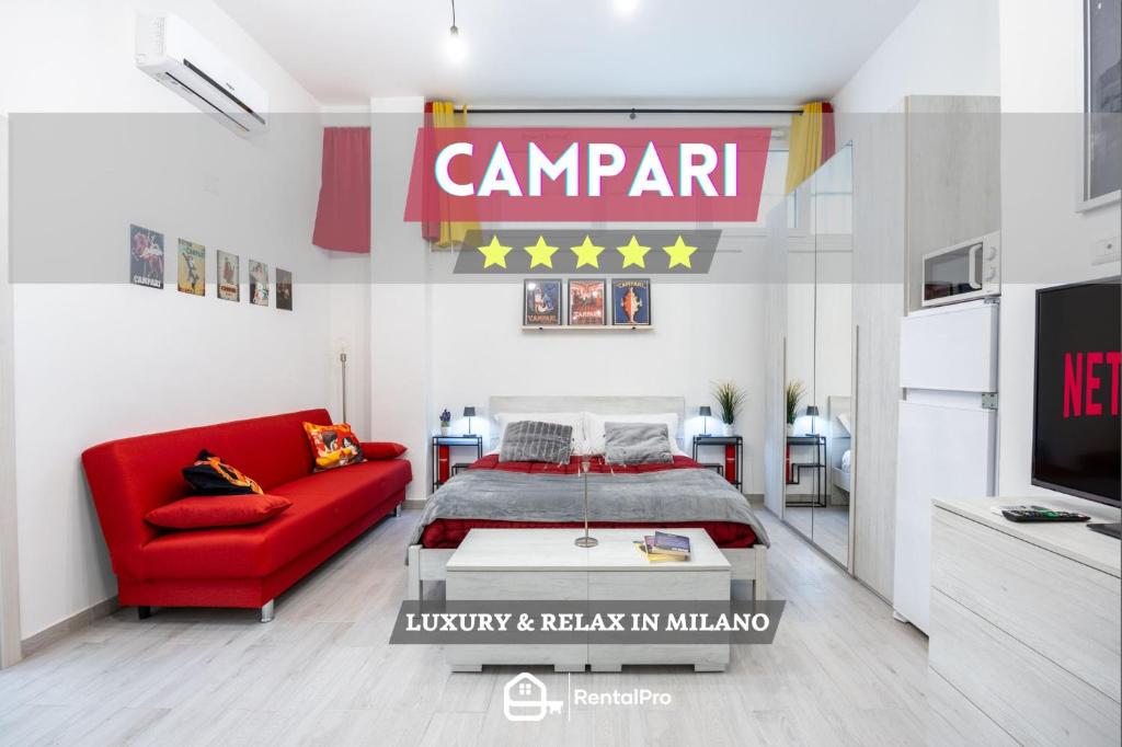 a room with a bed and a red couch at DUOMO-Sesto M1 Relax Campari Wi-fi & Netflix in Sesto San Giovanni