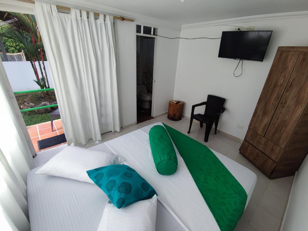 Una cama o camas en una habitación de Hotel Campestre Mastranto