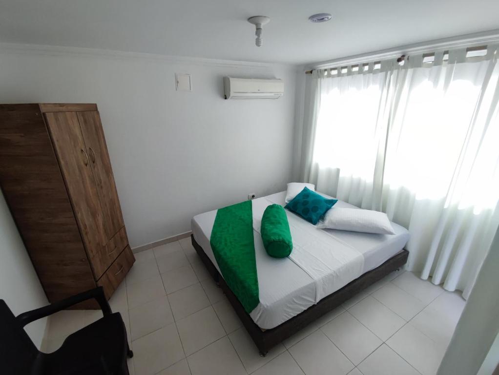 Una cama o camas en una habitación de Hotel Campestre Mastranto