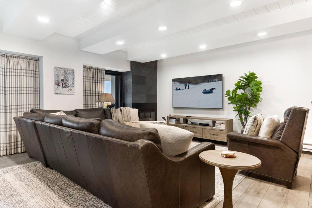a living room with a large couch and two chairs at Lodge at 100 W Beaver Creek Blvd 605 in Avon