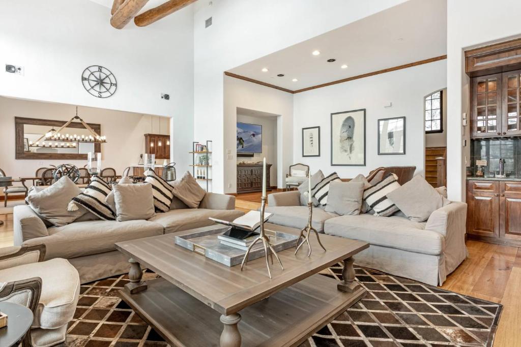 a living room with couches and a table at Quartermoon 1248 in Beaver Creek