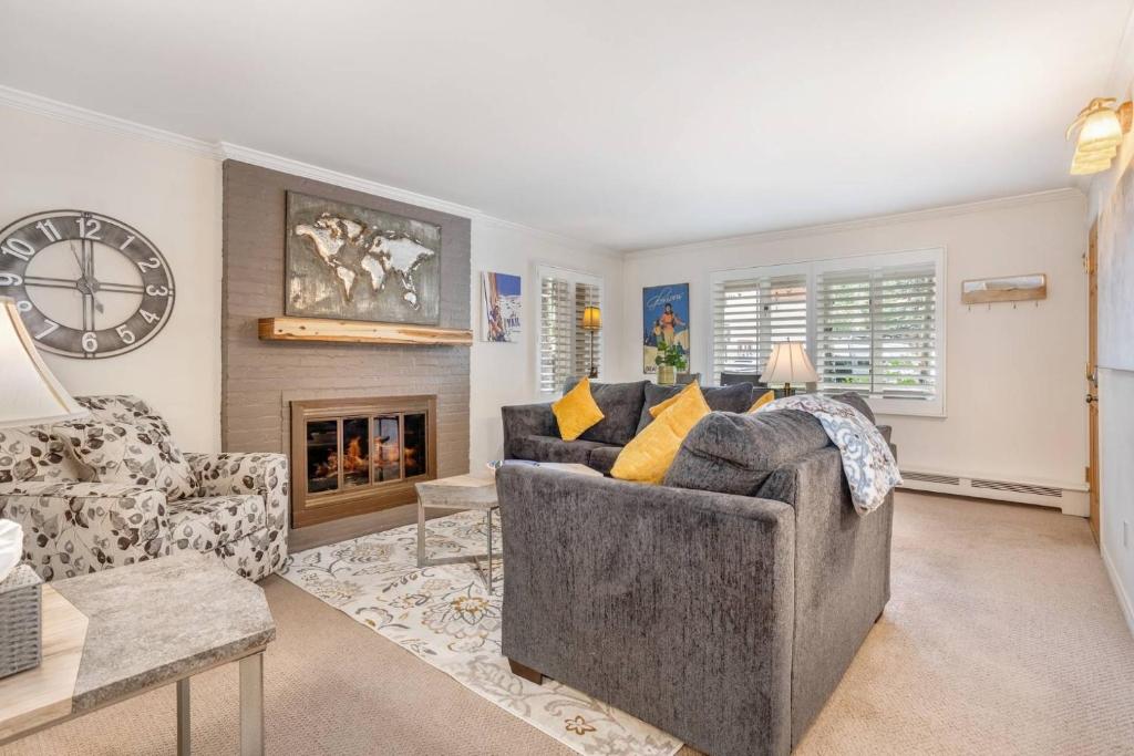 a living room with a couch and a fireplace at Vail Trails East 7A in Vail