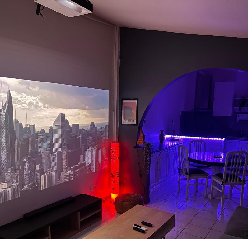 a living room with a view of a city at Suite Jacuzzi-Cinéma in Les Clayes-sous-Bois