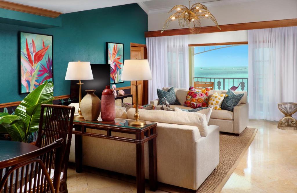 a living room with a couch and a table at Ocean Key Resort & Spa, a Noble House Resort in Key West