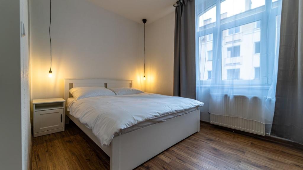 Postel nebo postele na pokoji v ubytování Hotel Cafe SokoLOVE