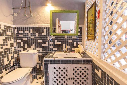 a bathroom with a toilet and a sink at MED APPARTEMENT in Essaouira