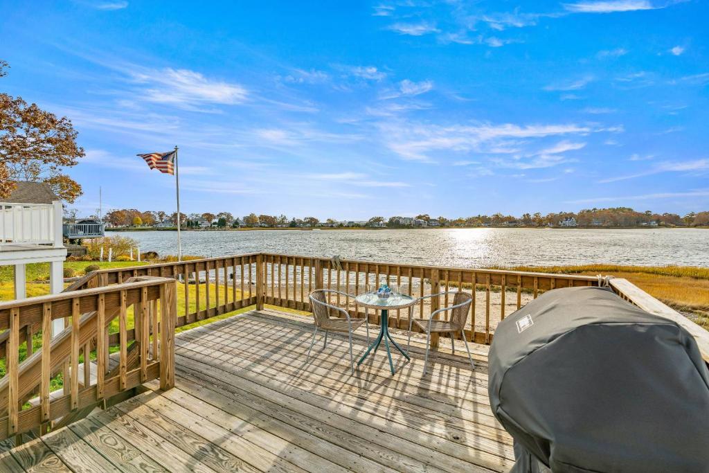 a deck with a table and a tent on it at 154 Pinehurst Dr, Wareham in Wareham
