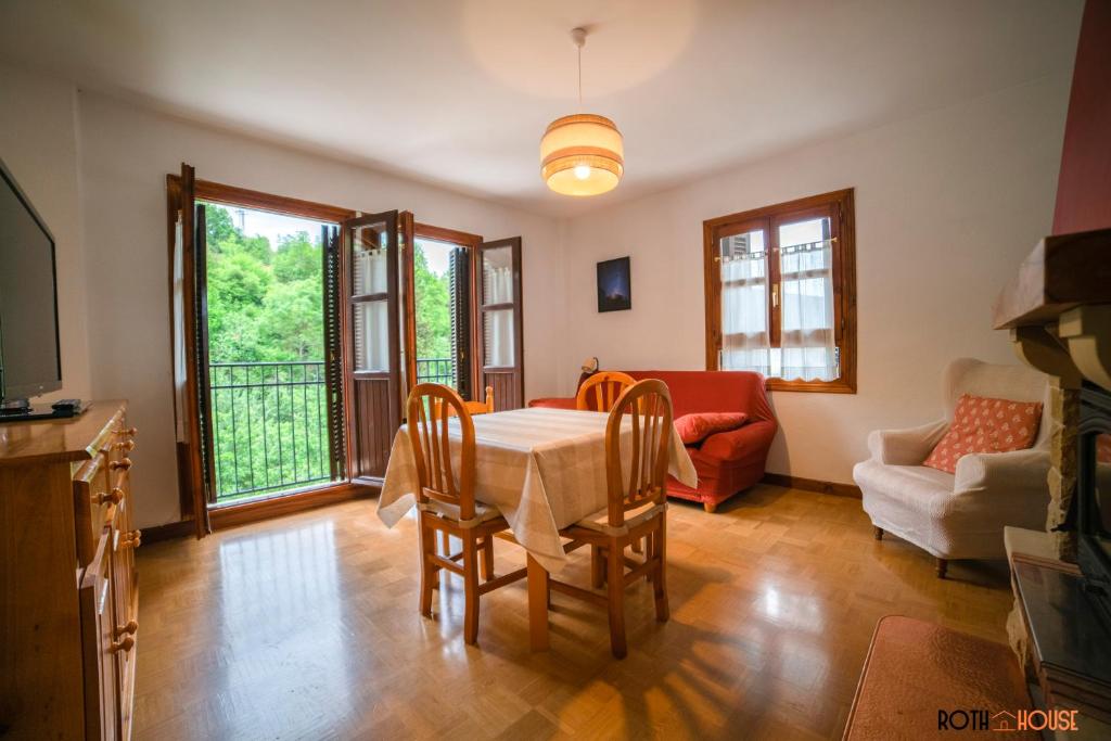 a living room with a table and chairs at Roth House in Ezcaray