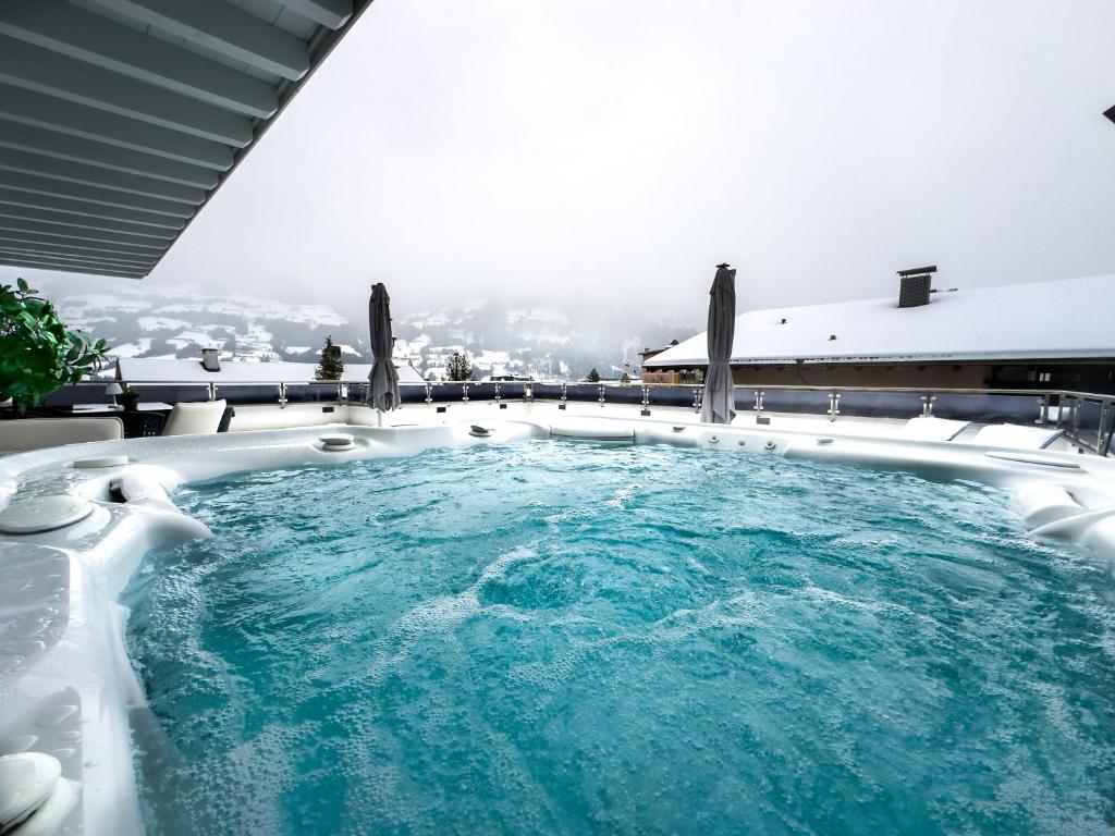 The swimming pool at or close to CLOUD 9 - Private Roof Terrace with Whirlpool by AlpenLuxus Appartements
