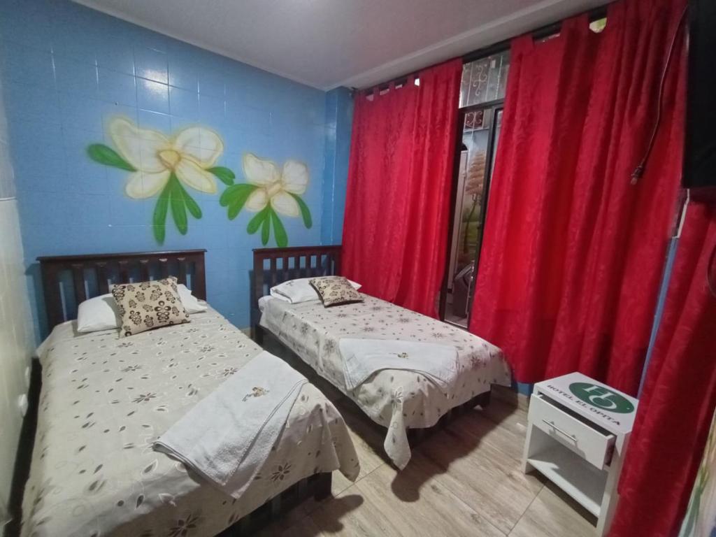 Postel nebo postele na pokoji v ubytování hotel el opita