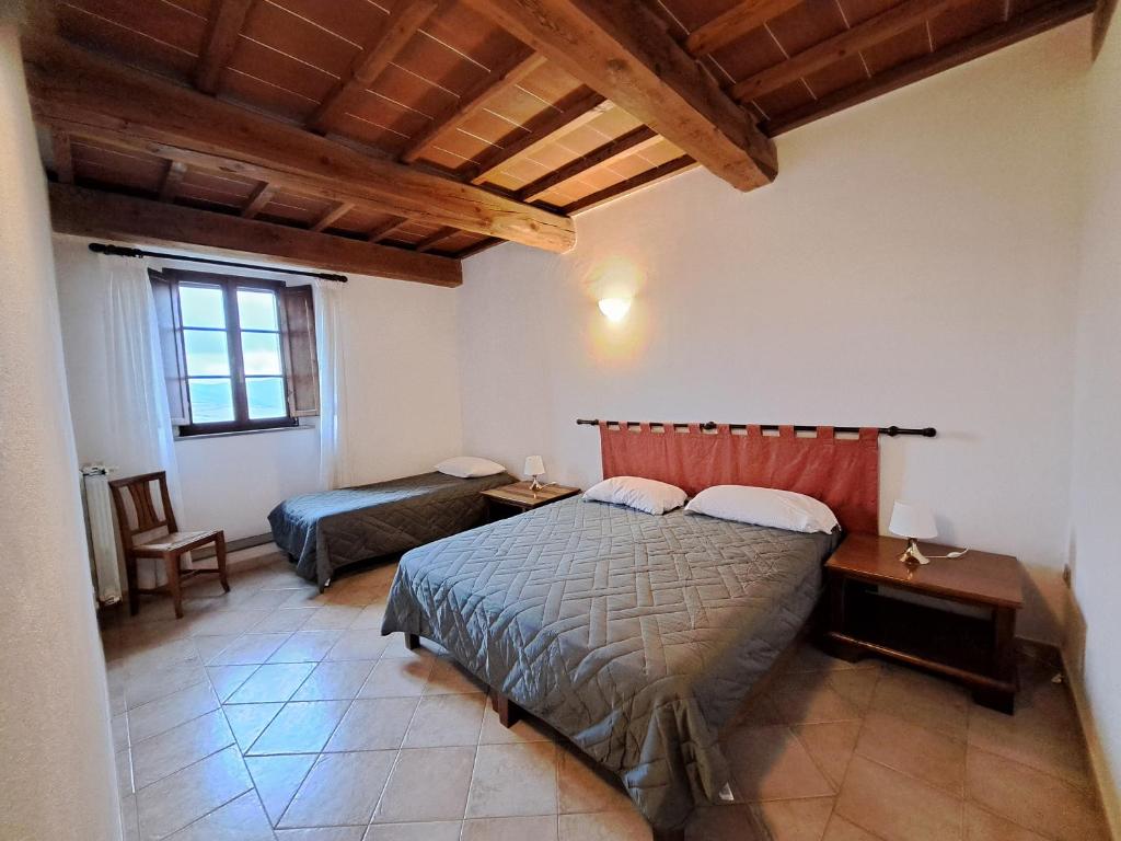 Postel nebo postele na pokoji v ubytování Le Valli Tuscany