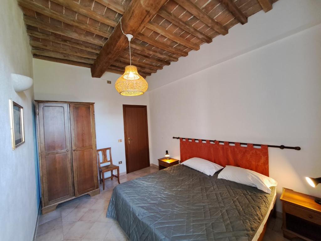 Postel nebo postele na pokoji v ubytování Le Valli Tuscany