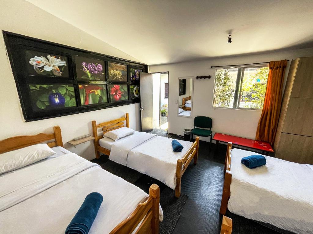 Postel nebo postele na pokoji v ubytování El Yarumo Hostel