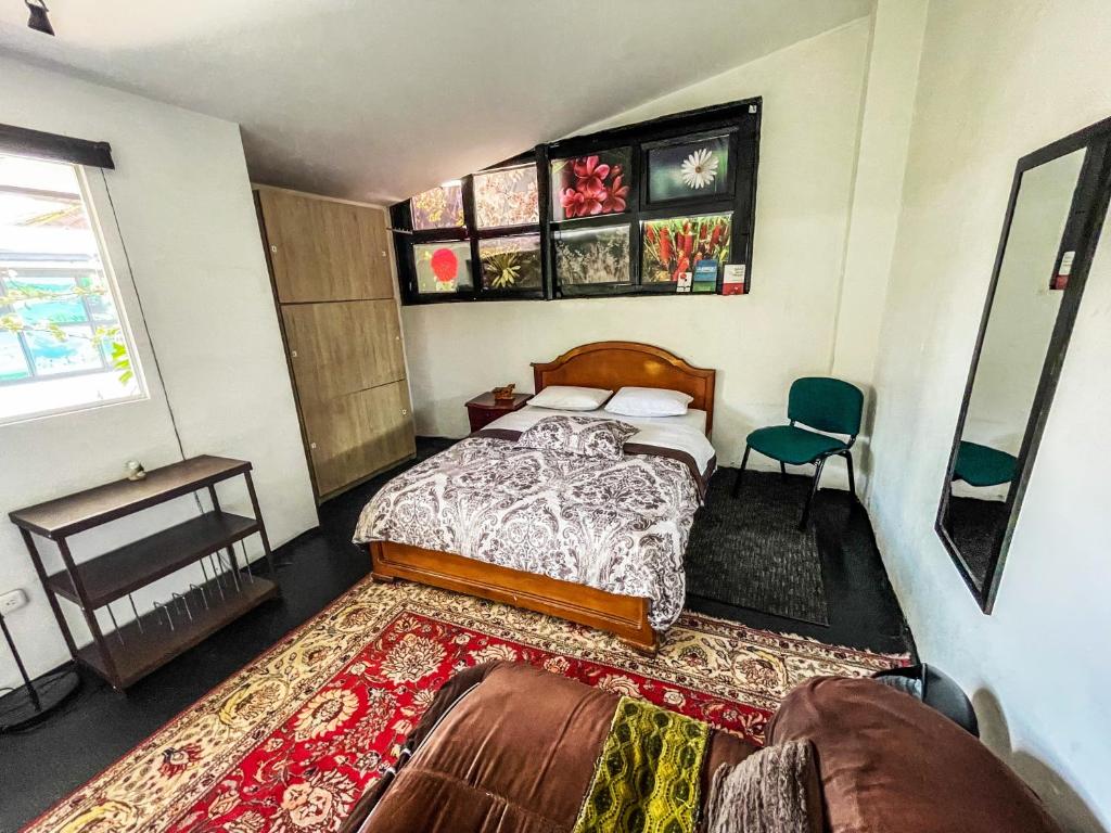Postel nebo postele na pokoji v ubytování El Yarumo Hostel