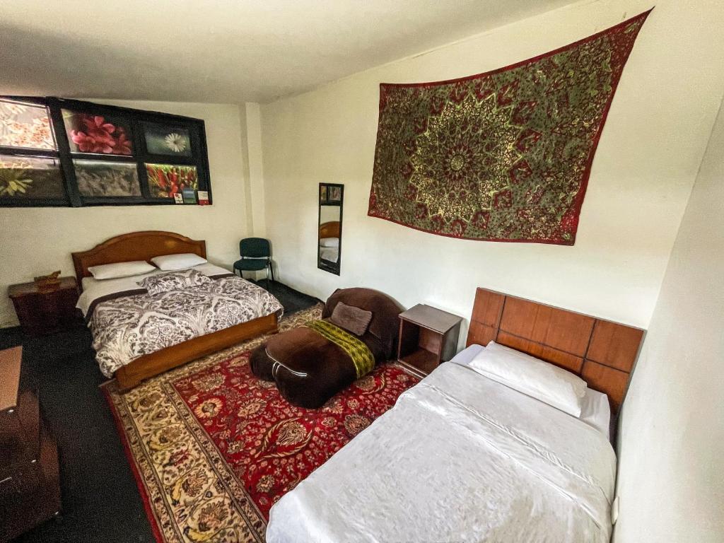 Postel nebo postele na pokoji v ubytování El Yarumo Hostel