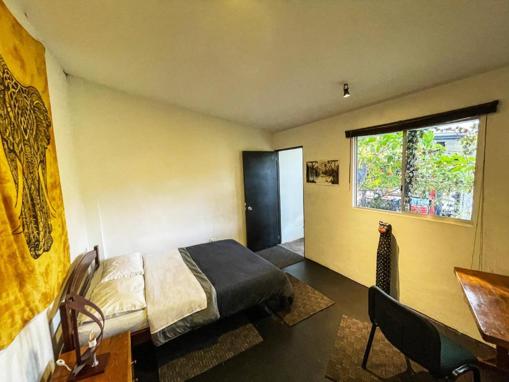 Postel nebo postele na pokoji v ubytování El Yarumo Hostel