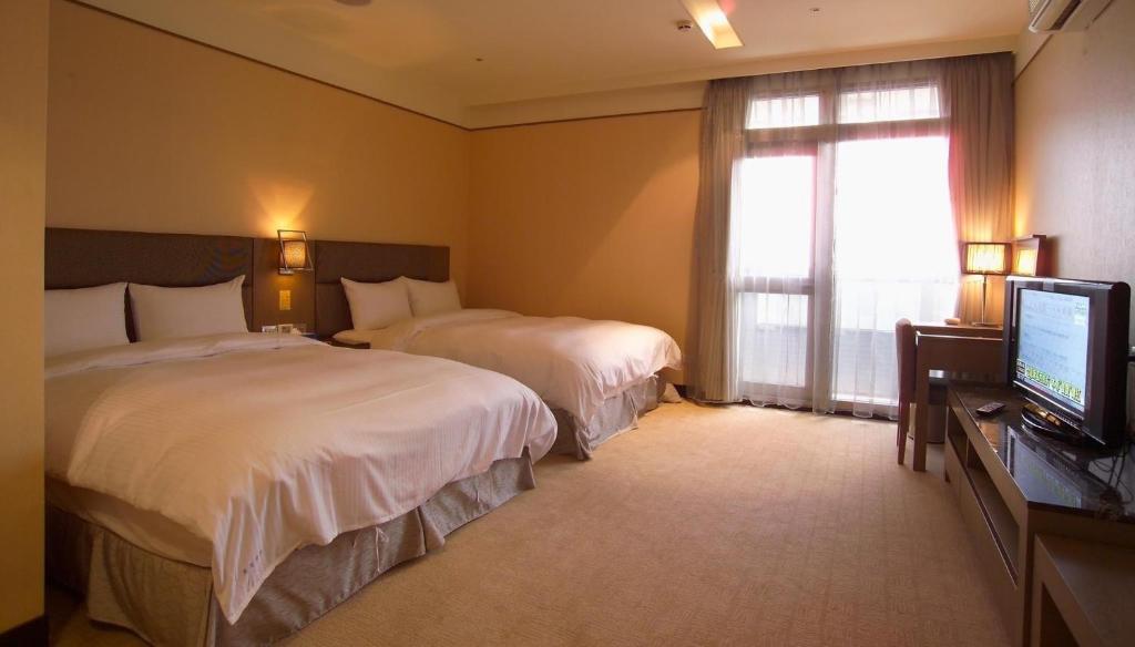 Postel nebo postele na pokoji v ubytování Rhine Inn