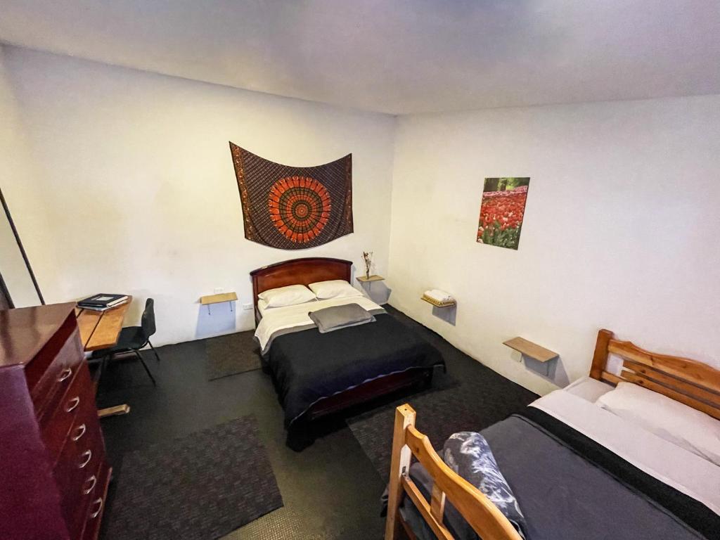 Postel nebo postele na pokoji v ubytování El Yarumo Hostel