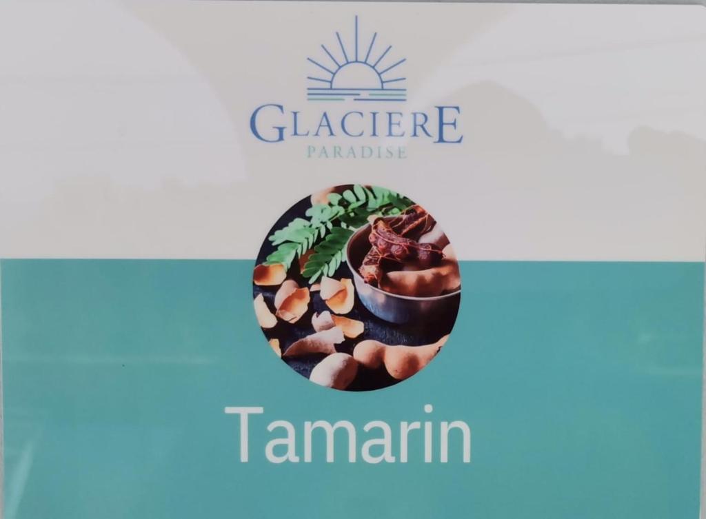 a logo for a garden company with a cactus at Glacière Paradise in Bouillante