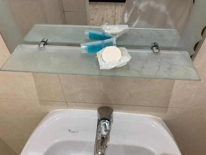 a sink with a faucet and a toothbrush on top of it at فيو بارك للشقق الفندقية in Al Hofuf