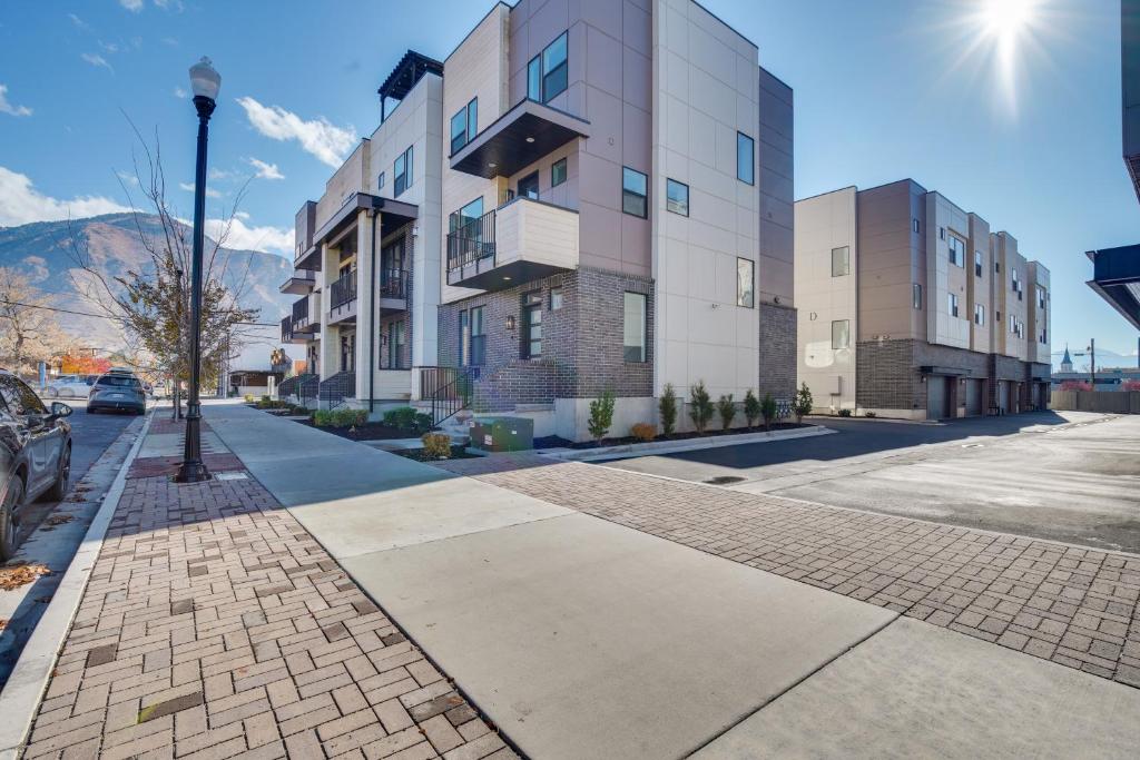 a building on a street with a street light at Modern Downtown Provo Townhome with Balcony! in Provo