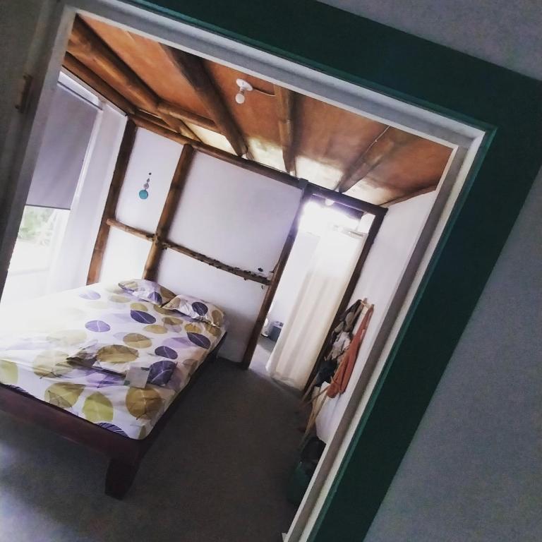 Postel nebo postele na pokoji v ubytování Flor de bambú