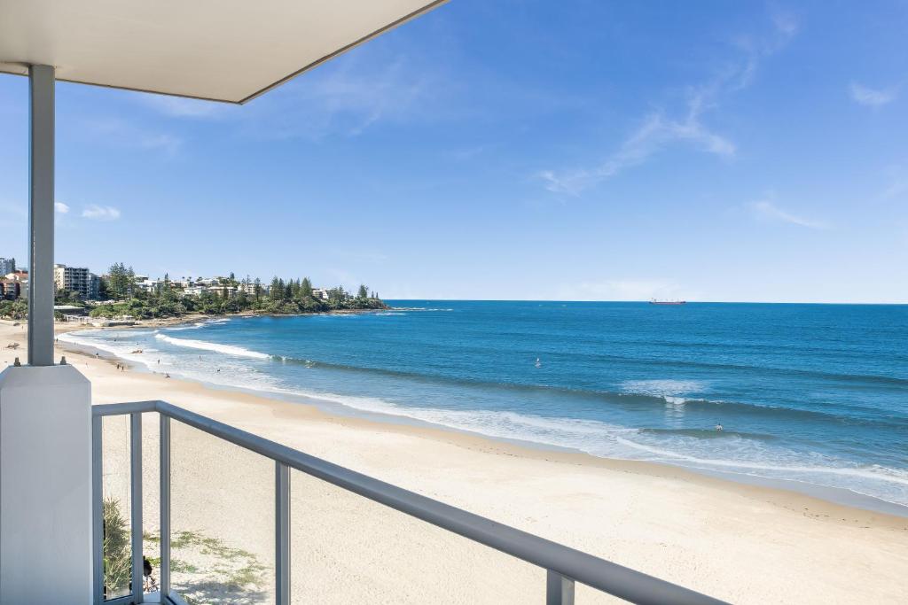 a view of the beach from a balcony at Pandanus Court in Caloundra