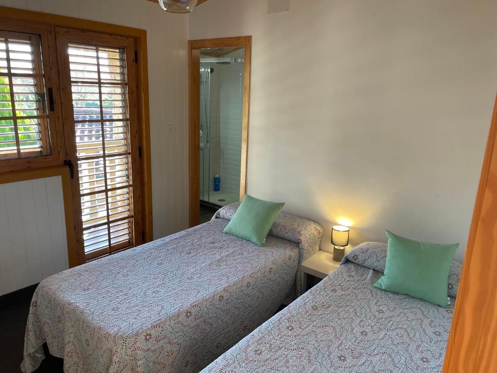 A bed or beds in a room at A Leira